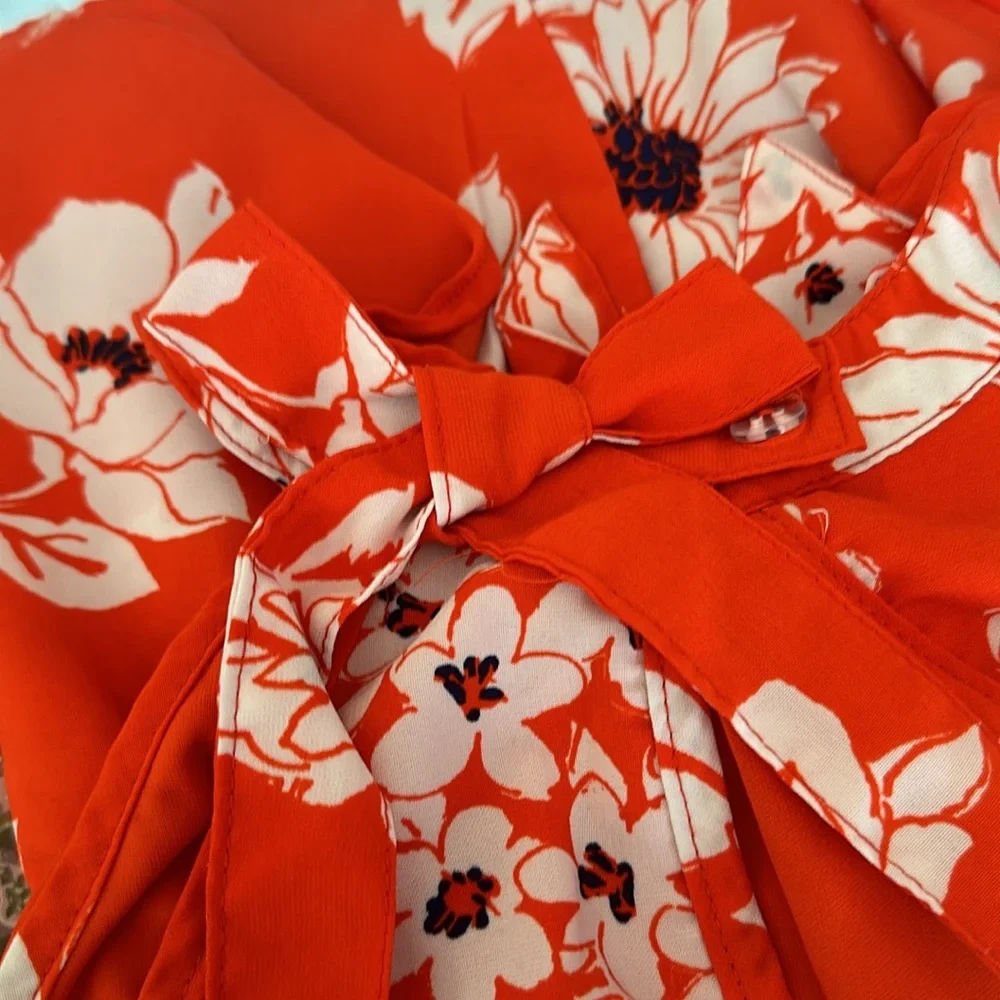 My Michelle girls floral romper orang & white one button bow in back. si…